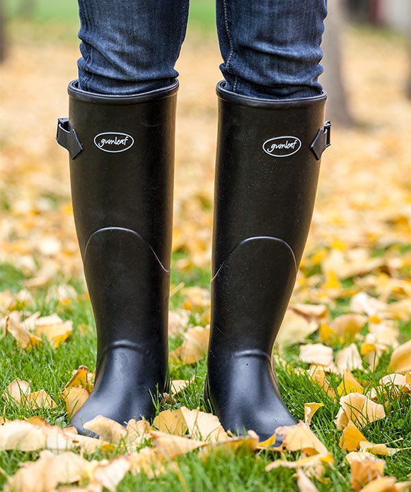 women in rubber riding boots